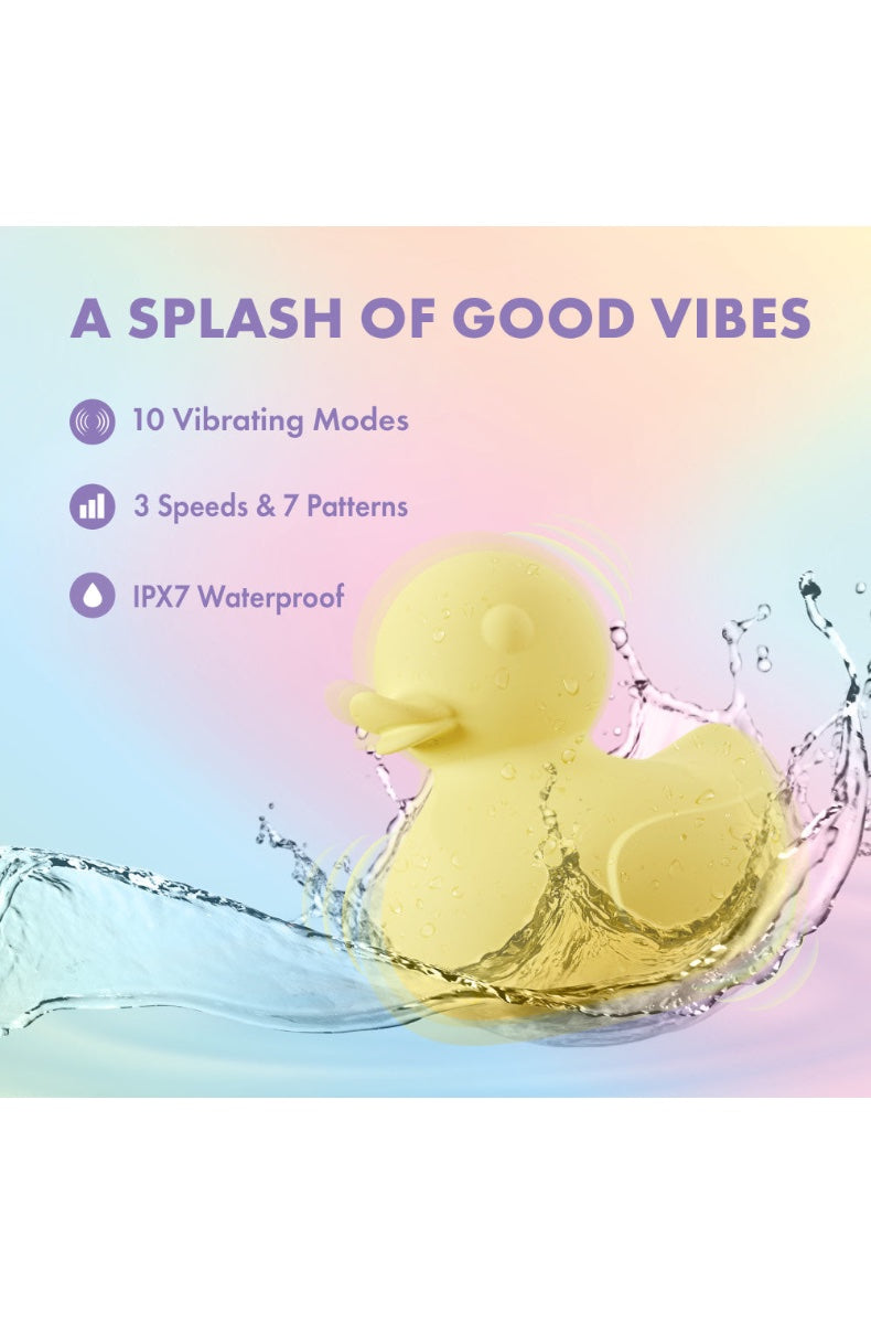 Yellow duck vibrator held in palm demonstrating size and ergonomic grip for bath use