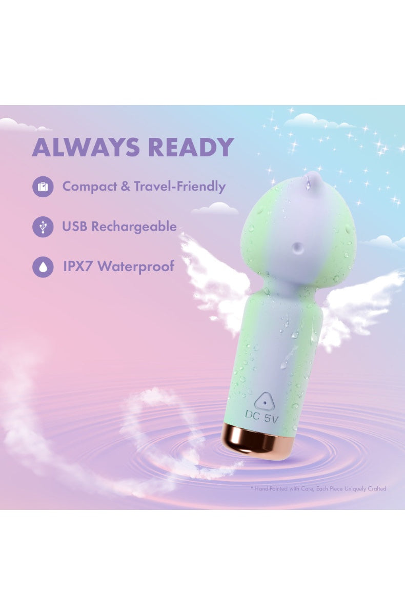 Front view of mint-purple gradient clitoral vibrator with textured unicorn head and rose-gold base