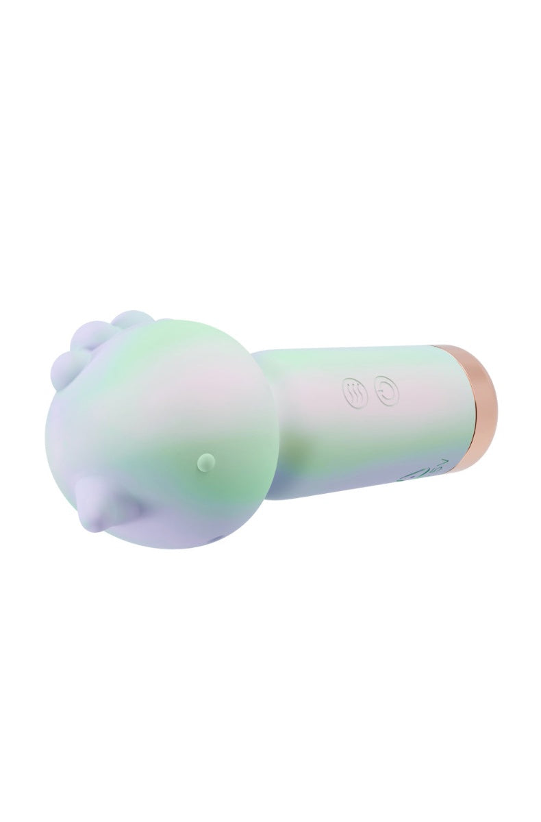 Side view of gradient vibrator in dreamy cloud scene with water droplets showing IPX7 waterproof rating