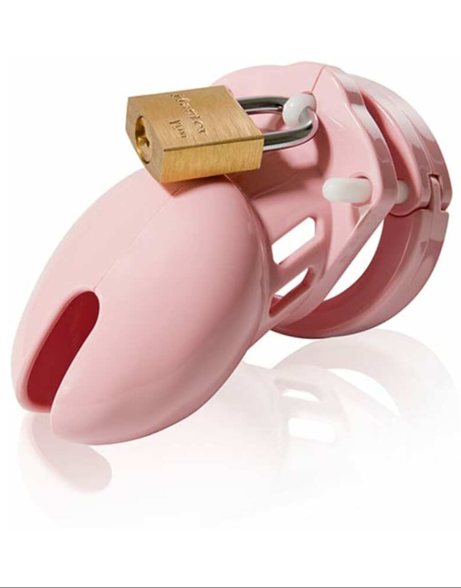 Pink CB-6000S chastity cage assembled with brass padlock, three-quarter view, on a white background.