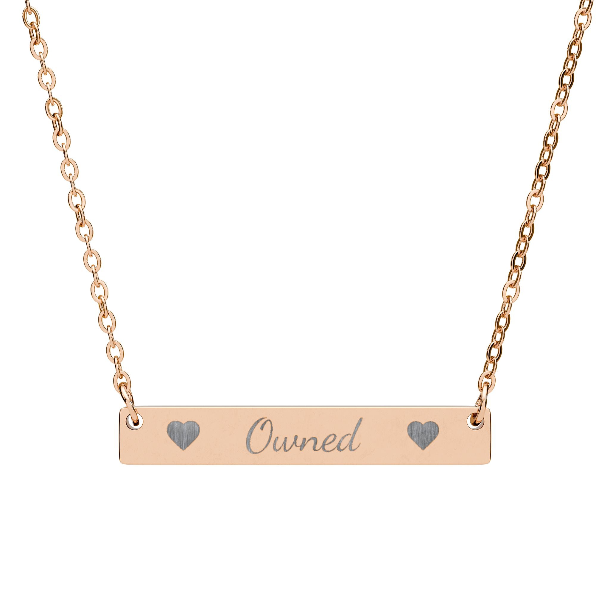 Rose gold necklace with engraved message on a white background