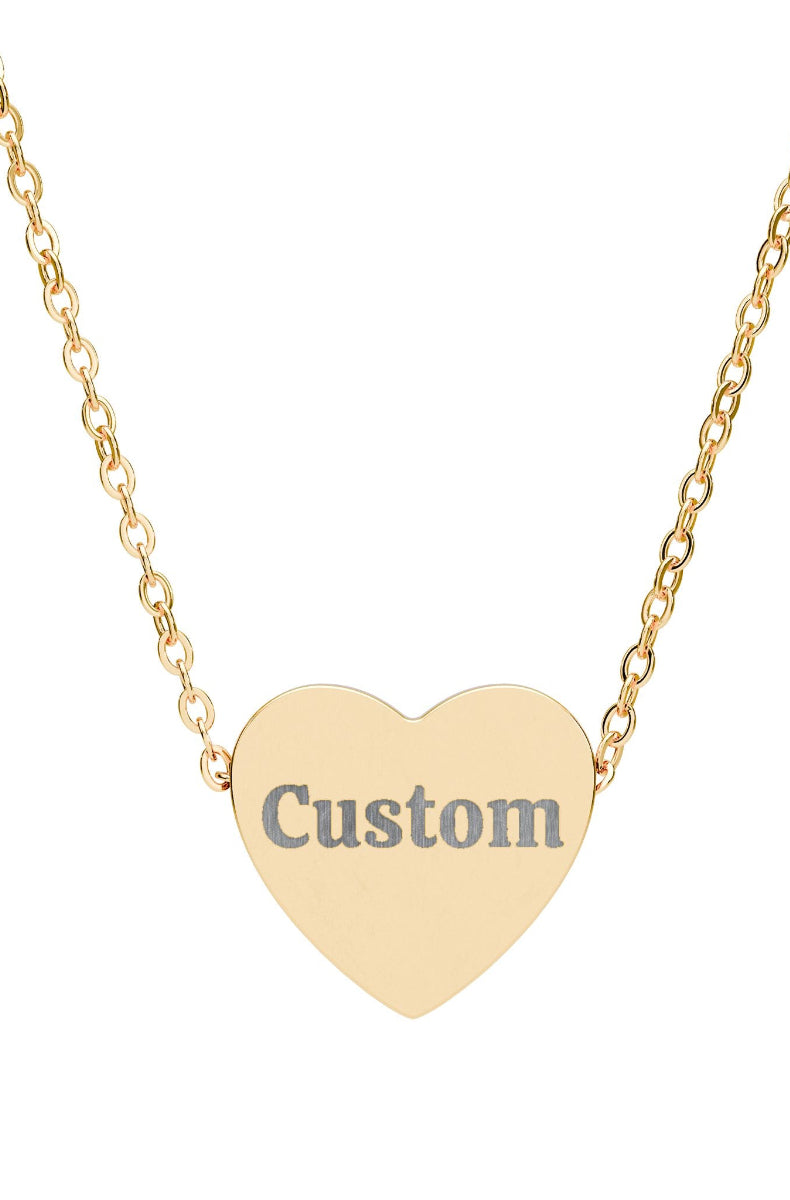 Gold heart-shaped necklace with 'Custom' engraving on a white background