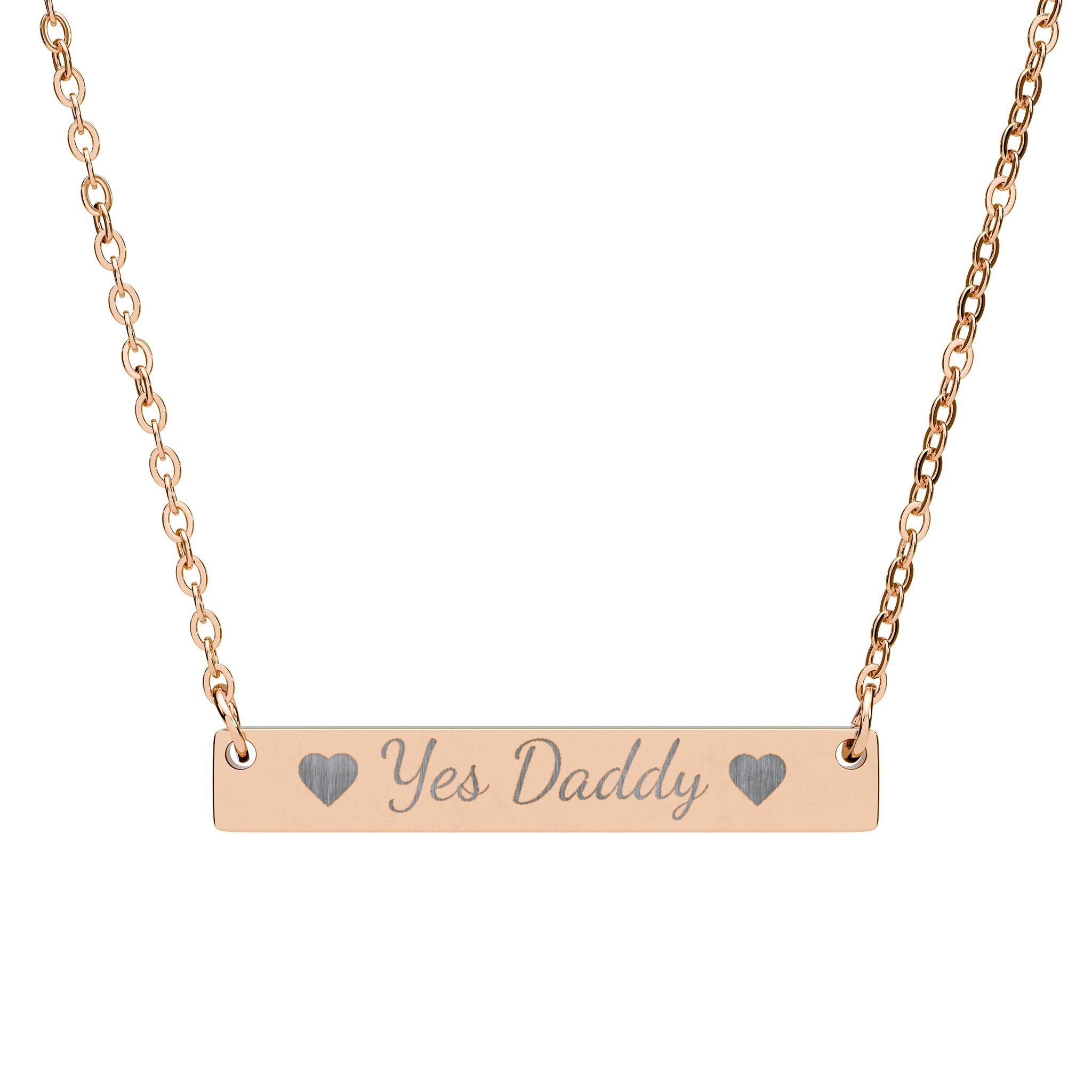 Rose gold necklace with 'yes daddy' pendant on a white background