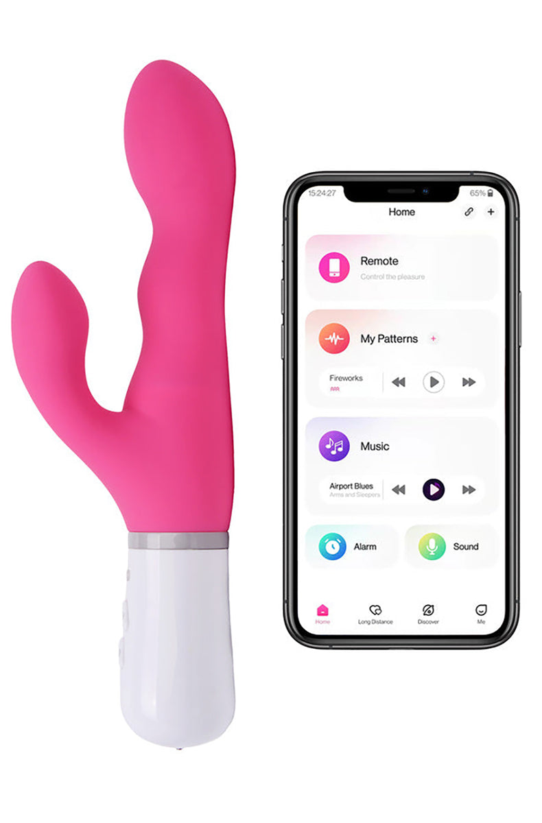 Lovense Nora hot pink rabbit vibrator with rotating shaft and clit arm, next to phone showing Lovense app.