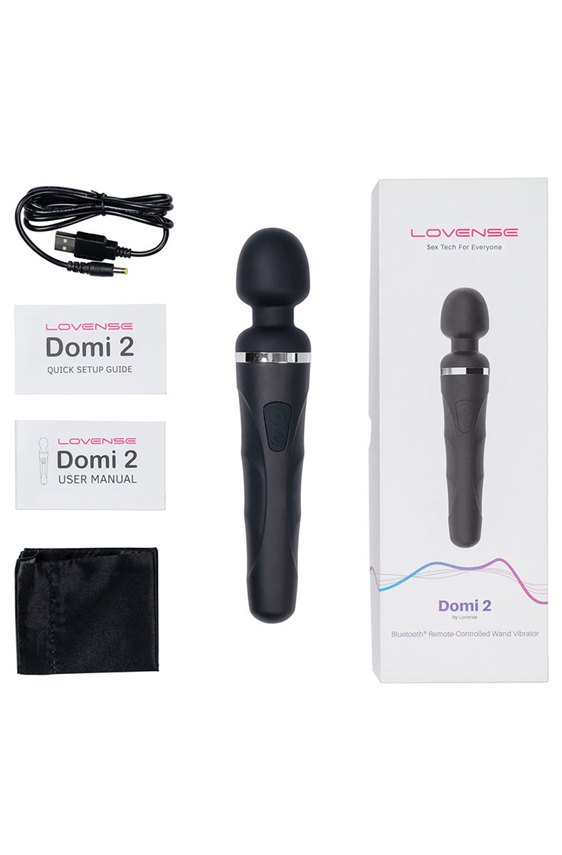 Lovense Domi 2 mini wand from a side angle showing the slim black handle and silicone head.