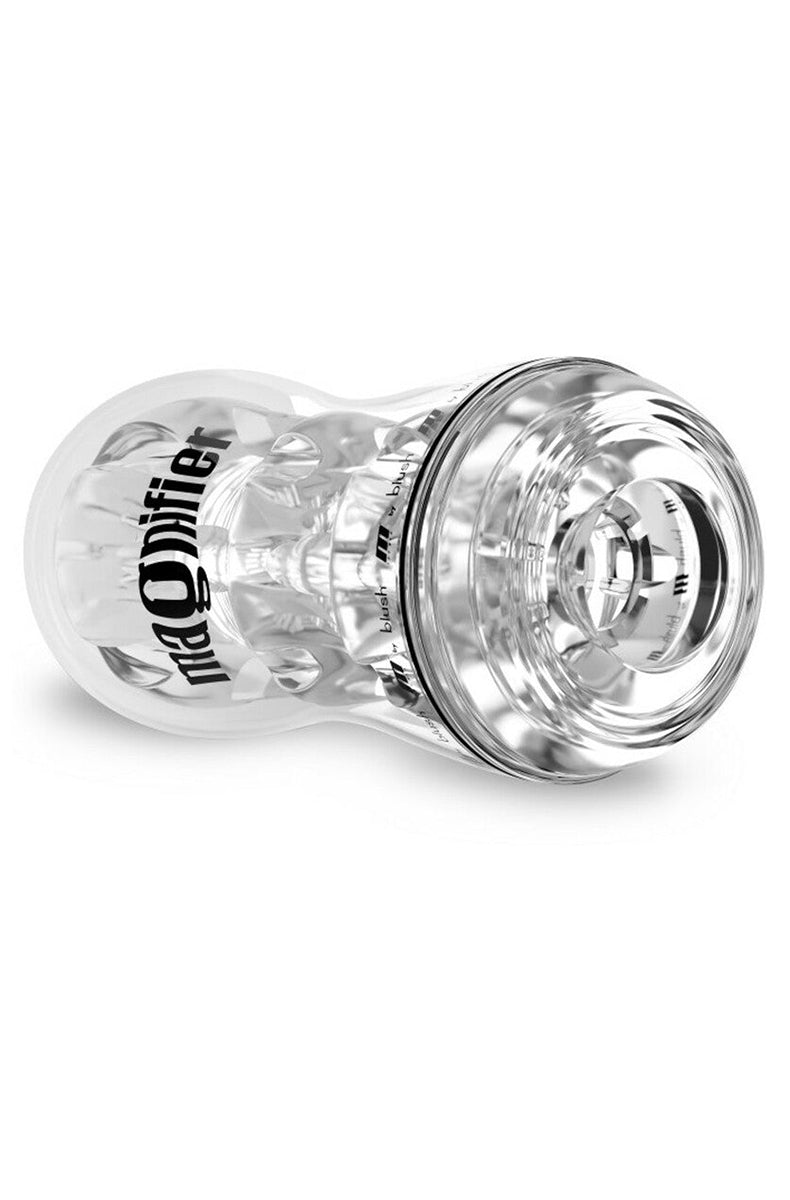 Tilted clear Magnifier stroker on its side showing the open entry chamber and base