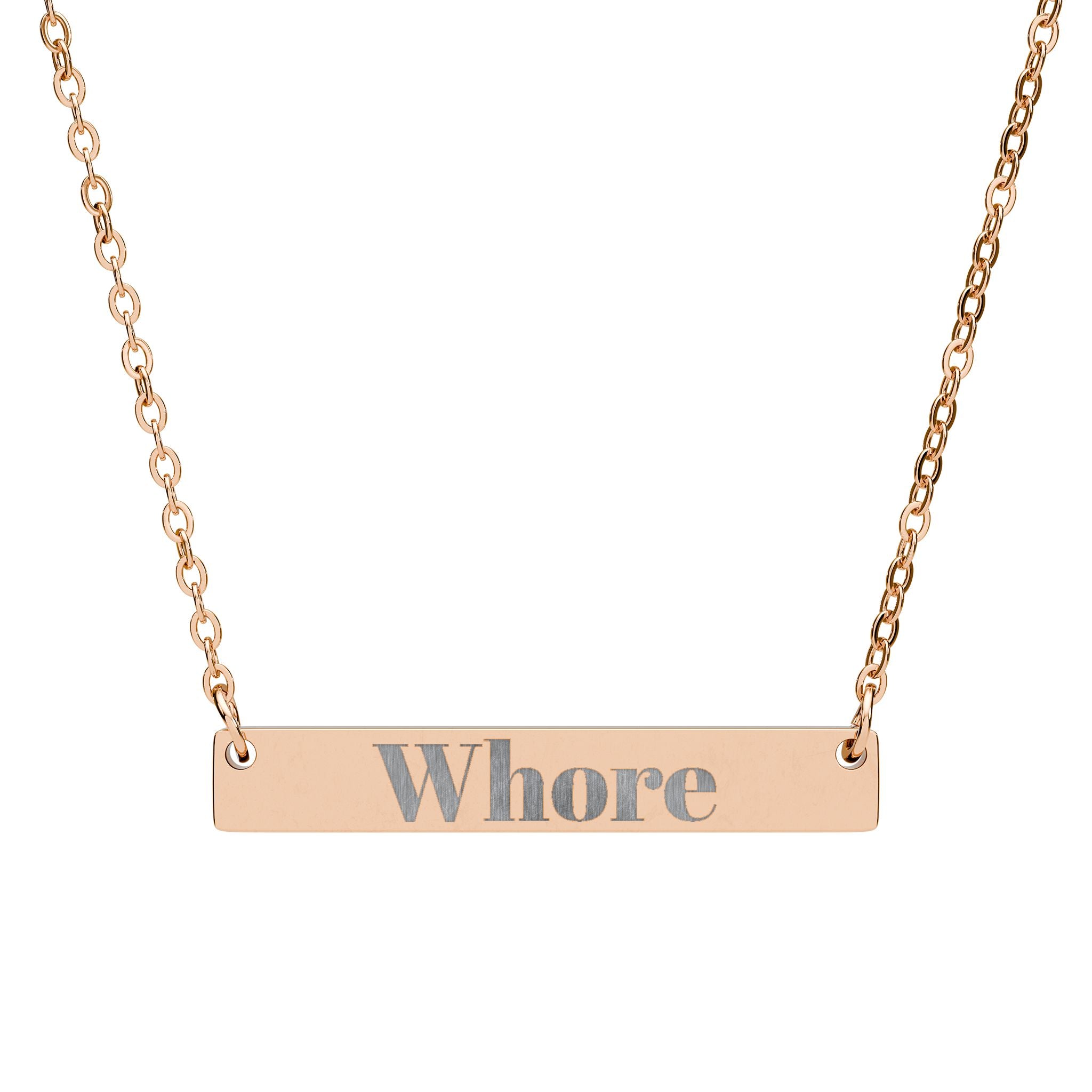Rose gold necklace with 'Whore' pendant on a white background