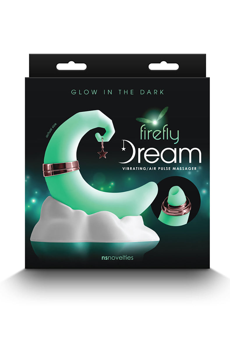 Firefly Dream air pulse vibrator shown glowing in the dark, crescent moon body and cloud base glowing soft green.