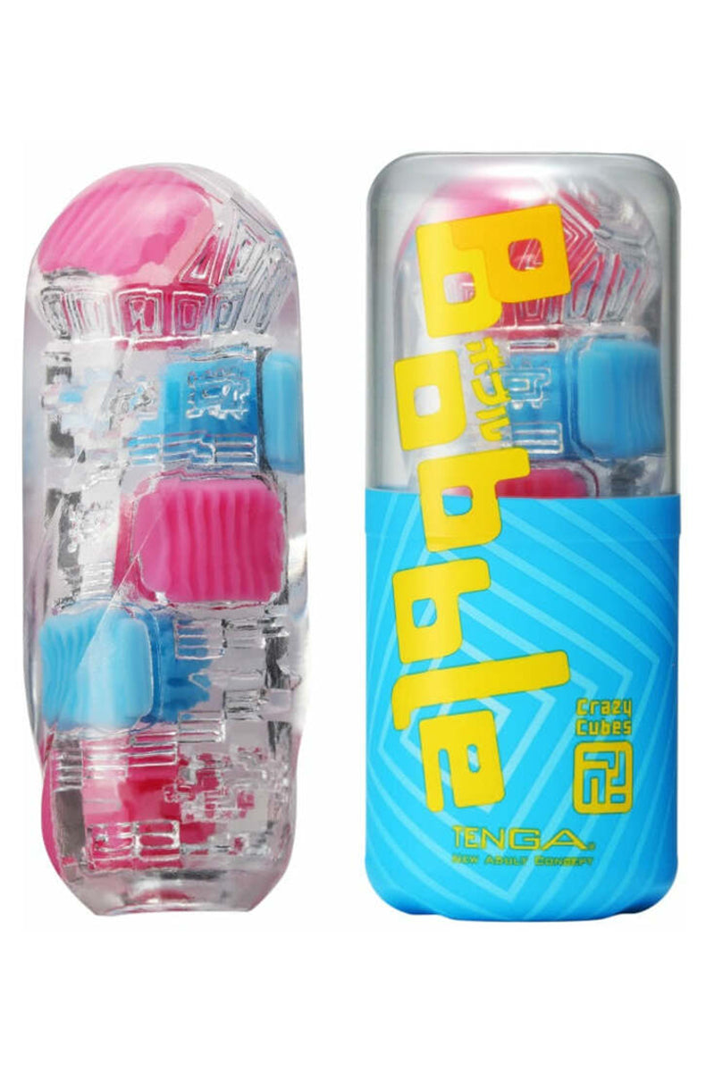 Tenga Bobble Crazy Cubes clear elastomer stroker with embedded pink and blue cubes and marbles, beside blue retail case.