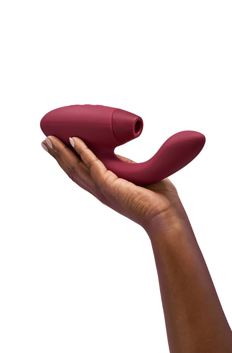 Angled view of Womanizer Duo 2 in bordeaux showing the silicone Pleasure Air tip opening at the clitoral head.