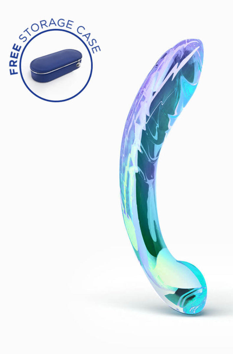 Iridescent blue, green, and purple glass G-spot dildo standing upright, with a free storage case badge, on white.