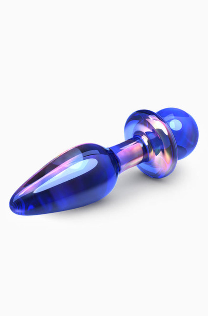 Blue iridescent glass anal plug lying down, showing the teardrop body, flared disc base, and round ball end, on white.