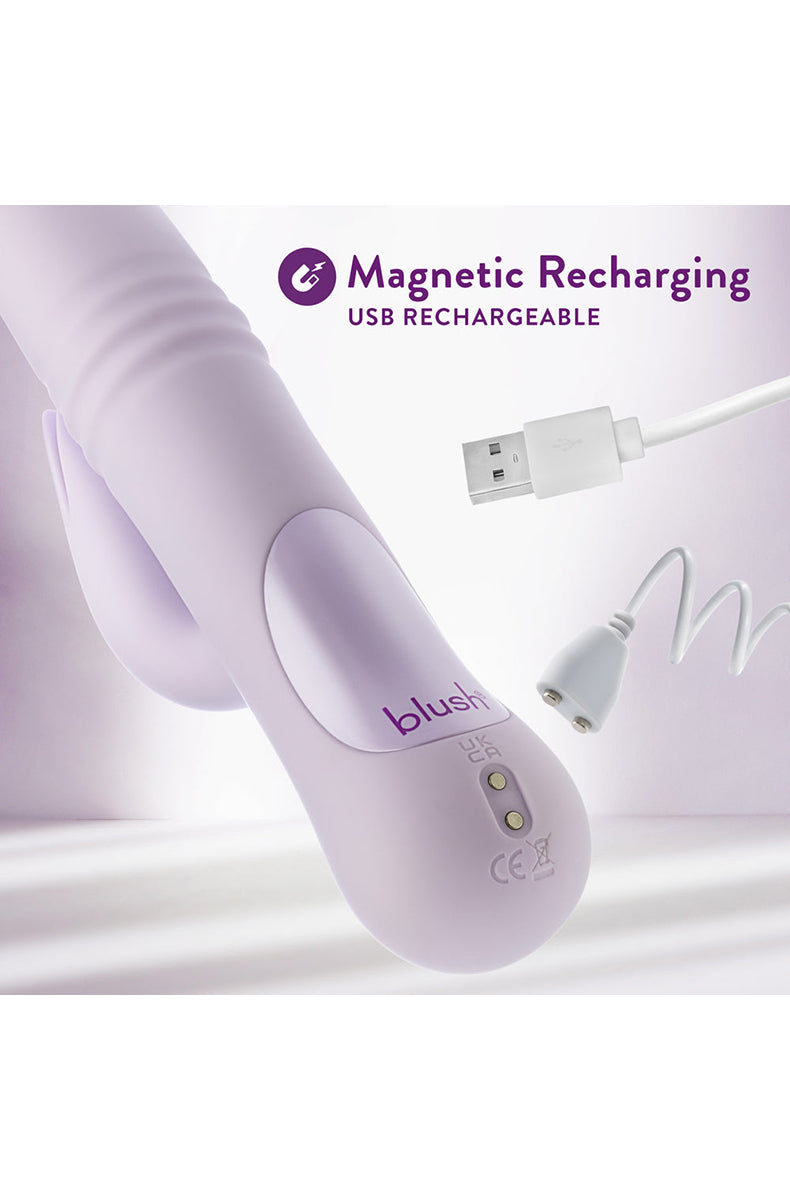 Soft lavender silicone Rylee thrusting rabbit vibrator with USB charging cable, accessory view.