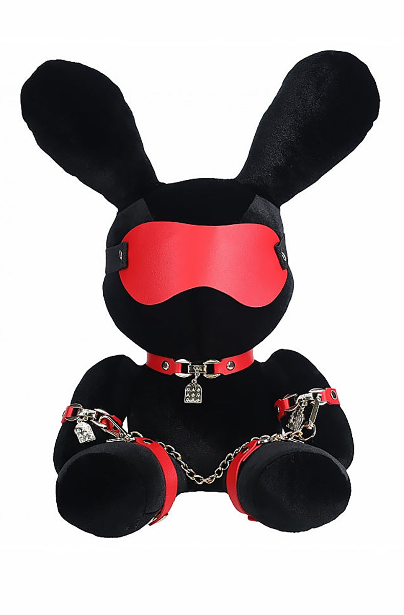 Black velvet plush bunny with long upright ears, red blindfold, red collar with padlock, and red wrist and ankle cuffs.