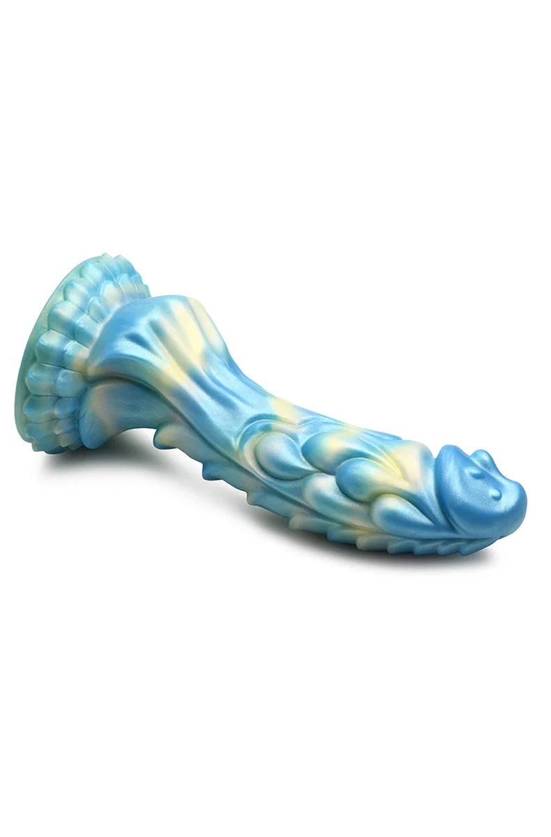 Side profile of Sea Stallion dildo lying flat showing seahorse head, scales and base