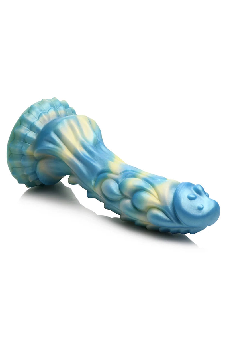 Top down angle of Sea Stallion silicone dildo showing detailed scale texture and tip