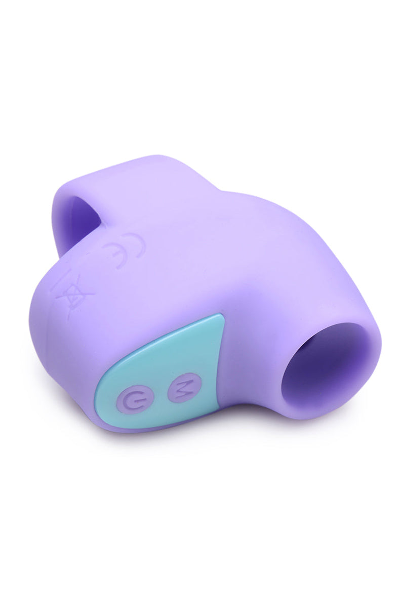 Front view of purple Shegasm Mini air-pulse finger vibrator with suction hole at the tip.