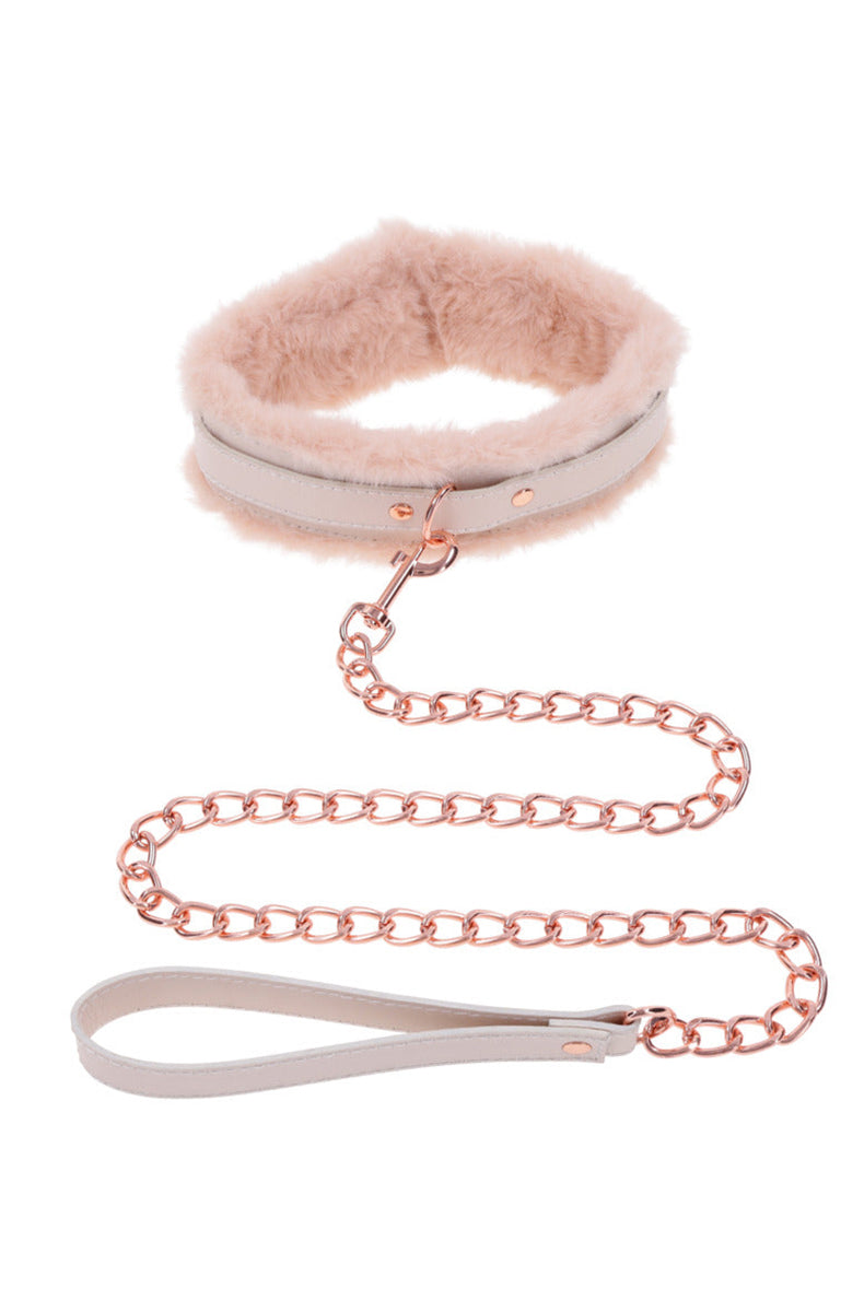 Cream faux leather collar with peach faux fur lining, rose-gold hardware, and a rose-gold chain leash with cream hand loop.