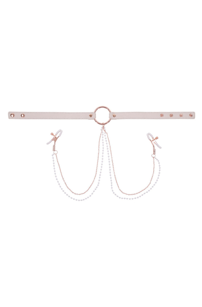 Detail view of cream faux leather collar with rose-gold O-ring and buckle hardware.