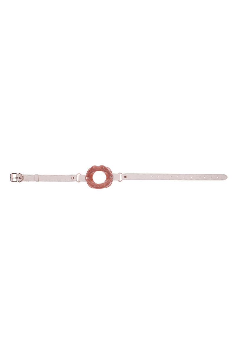 Back view of the peach silicone lips gag showing the flat inner side and strap attachment points.
