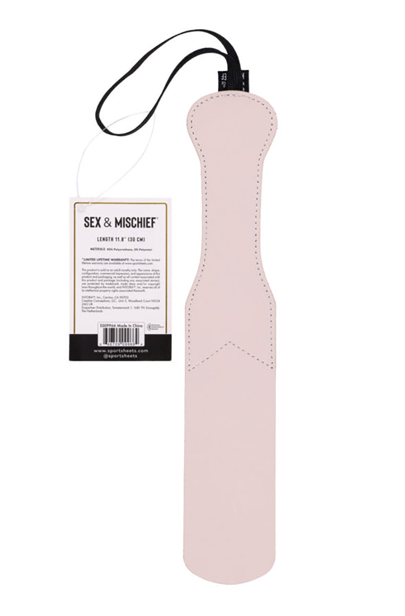 Back view of the cream paddle showing solid stitched cream surface with hang tag listing length 11.8 inches.