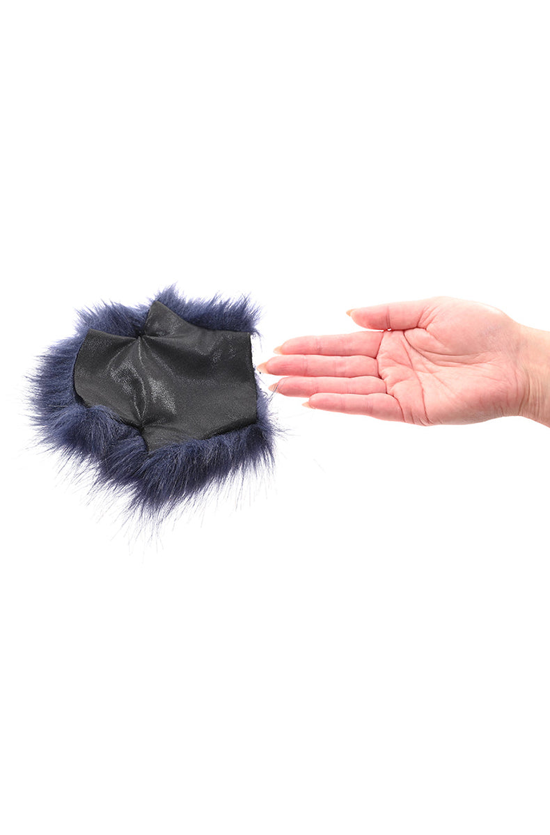 Close-up of the inner lining at the wrist opening of the navy faux fur mitt.