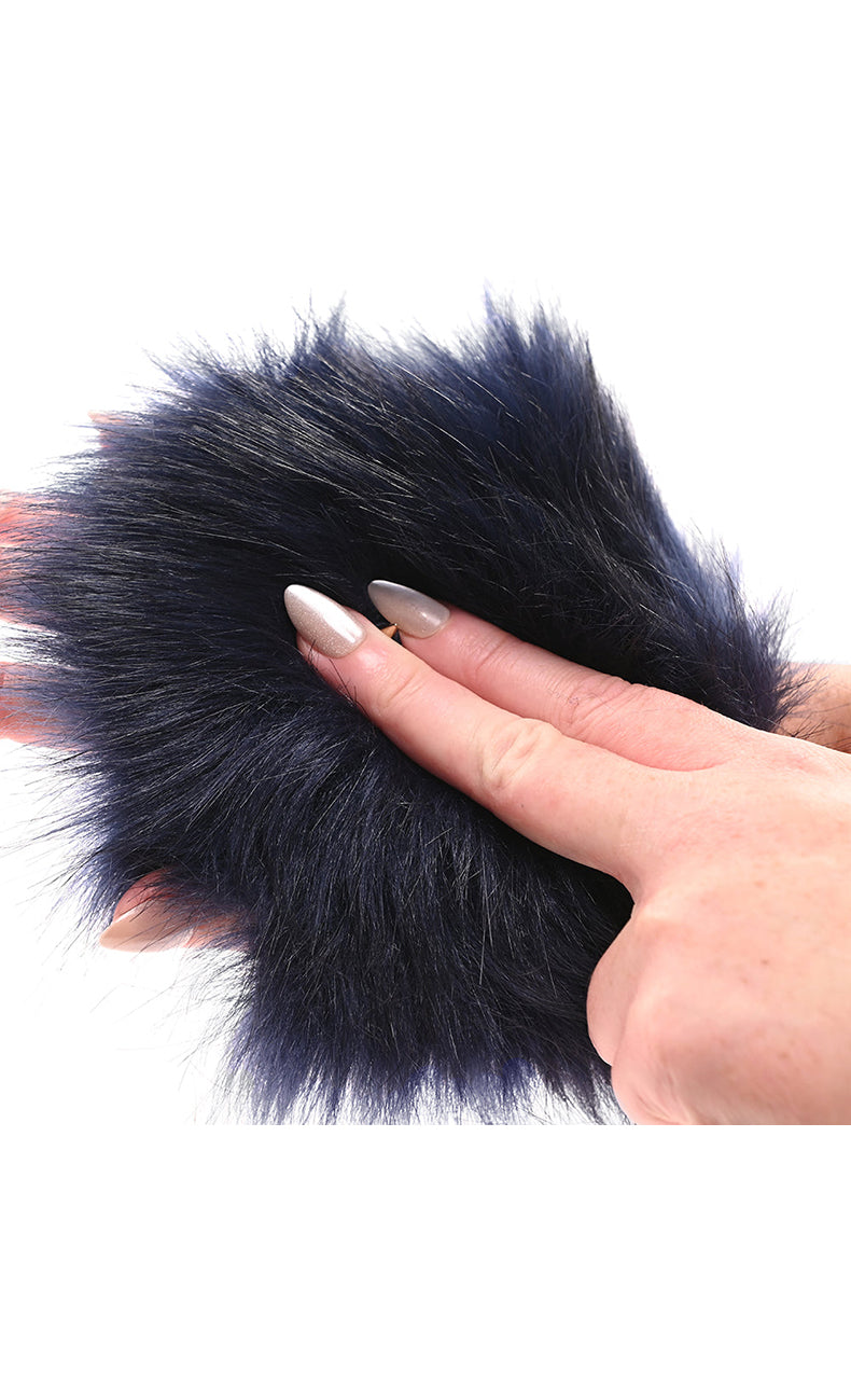 Detail view of long navy faux fur fibers showing texture and softness of the sensory mitt.
