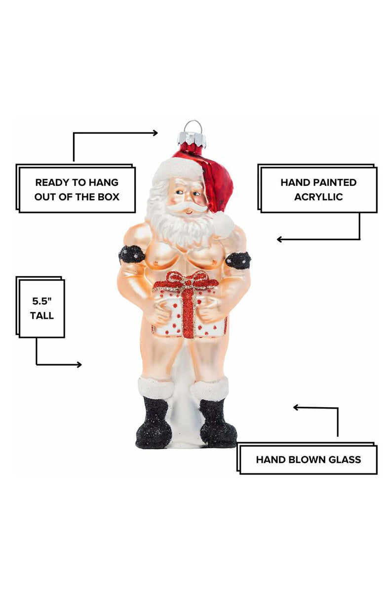 Close-up of shirtless muscular Santa face and red hat on hand-blown glass ornament.