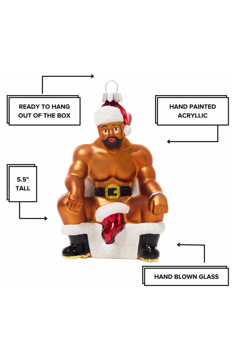 Close-up of bearded face and Santa hat on hand-blown glass chimney ornament.
