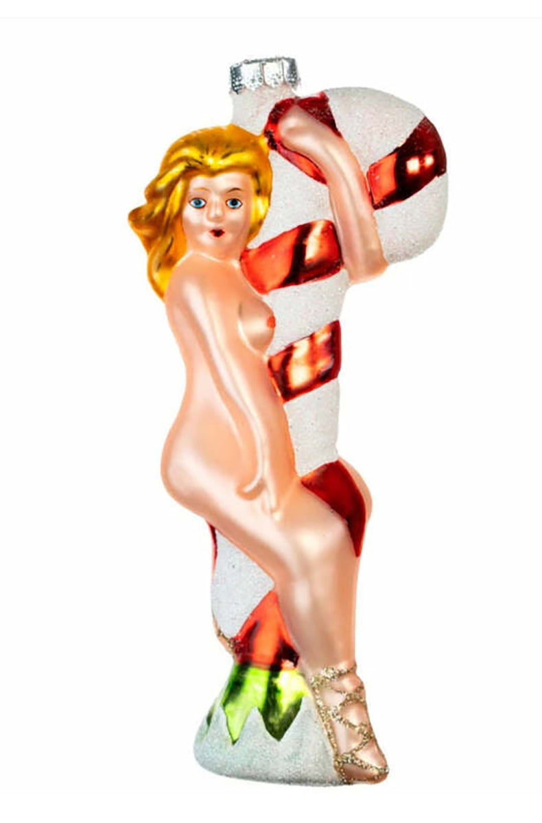 Hand-blown glass ornament of a nude blonde elf wrapped around a red and white candy cane stripper pole in green shoes.