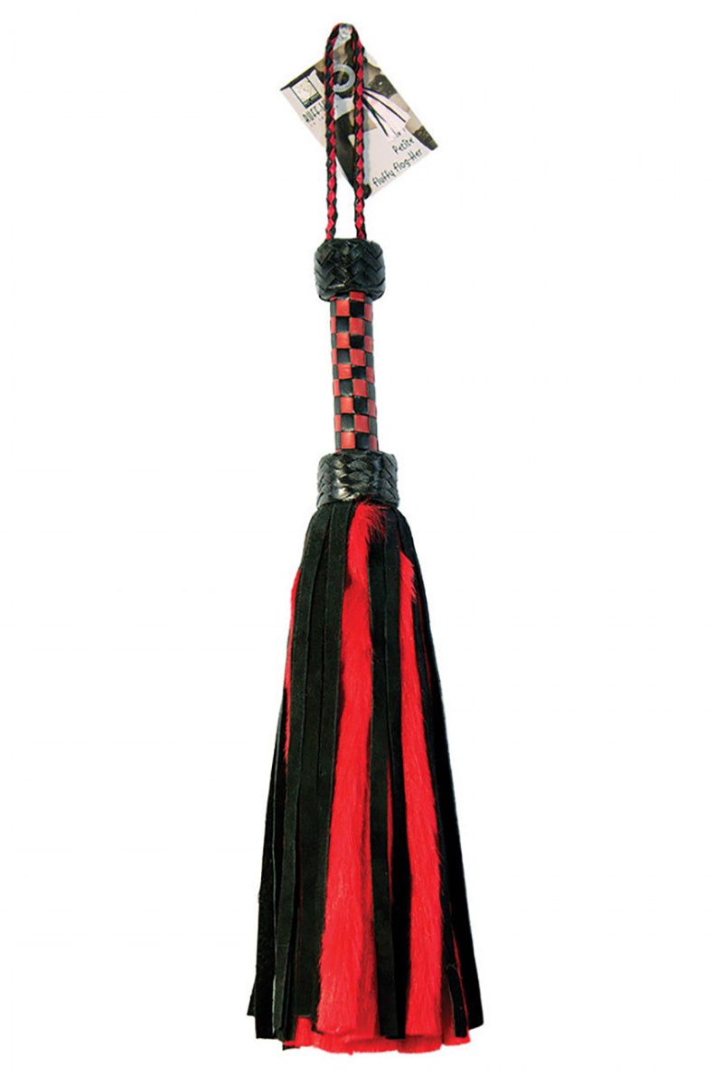Detail view of the red faux-fur and black suede tails packaged with a hangtag at the top of the braided handle.