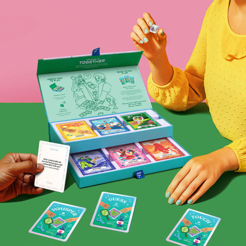 Biird Together couples card game in play with the glass dice
