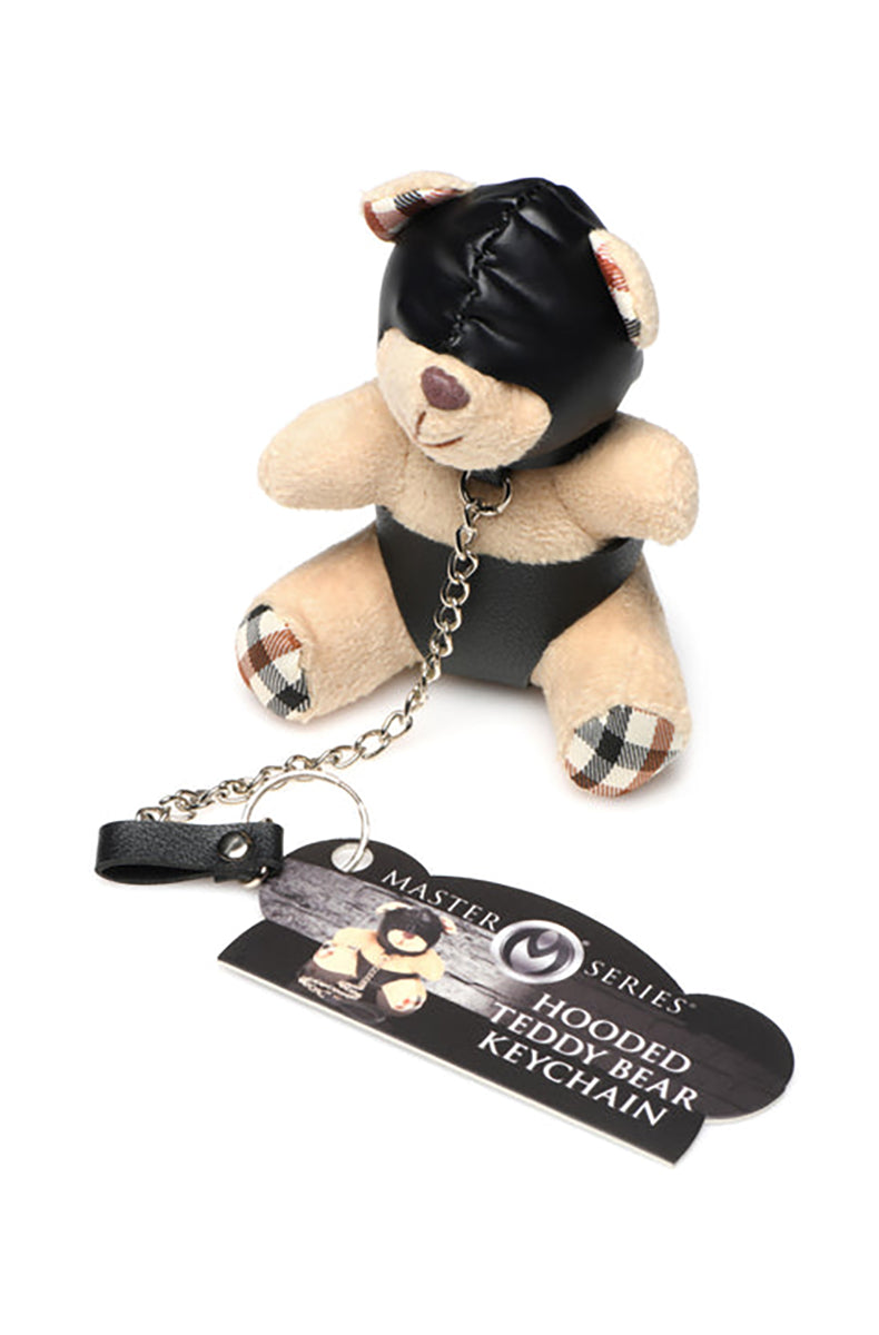 Side view of tan plush teddy bear keychain in black PU hood and panties with silver chain leash.
