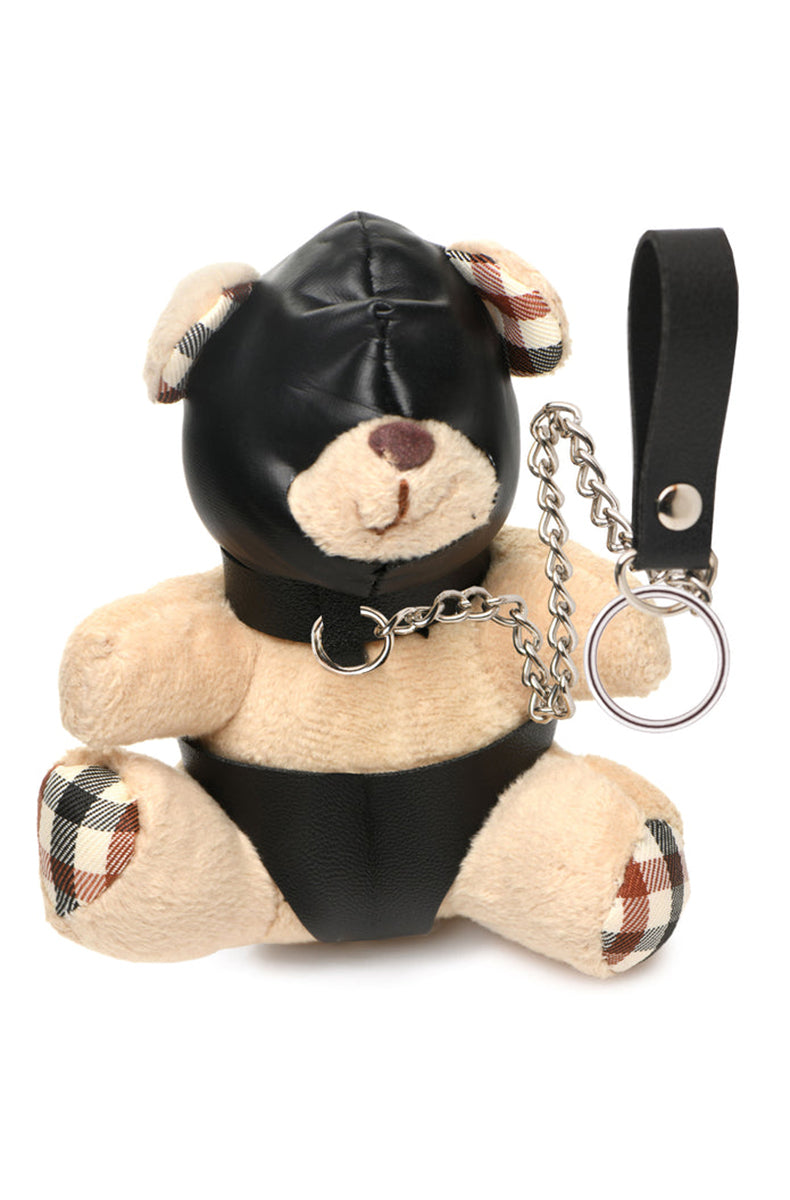 Tan plush teddy bear keychain wearing black PU leather hood and panties, with a silver chain leash and PU hand loop.