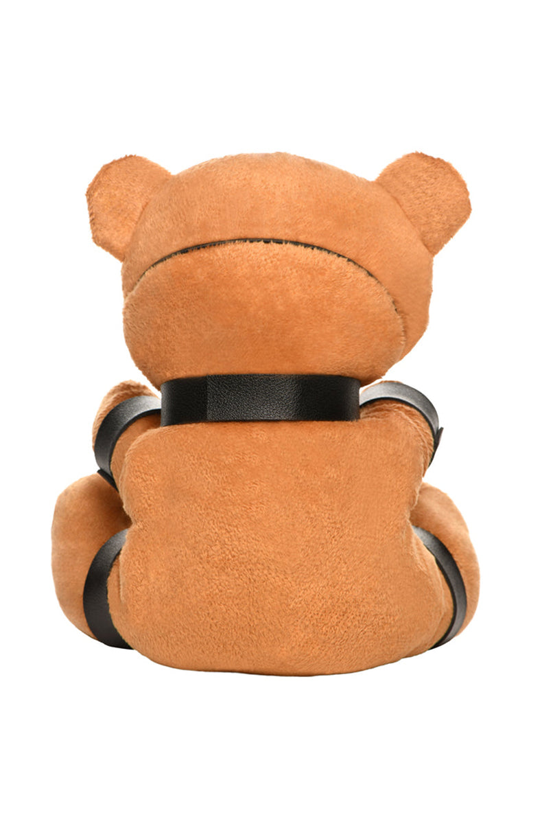 Back view of tan plush teddy bear keychain showing black ankle cuffs and silver chain connections.