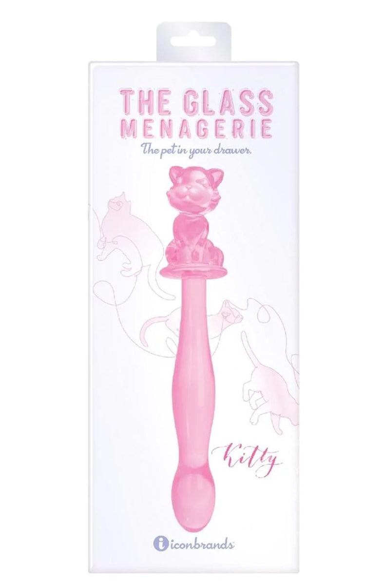 Side view of pink glass kitty dildo showing the seated cat figure on top and the long shaft with rounded tip.