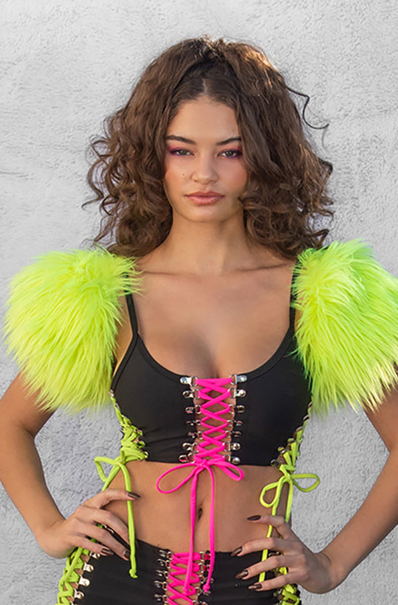 Model wearing black crop tank with neon pink and yellow corset lacing and neon yellow faux fur shoulder caps
