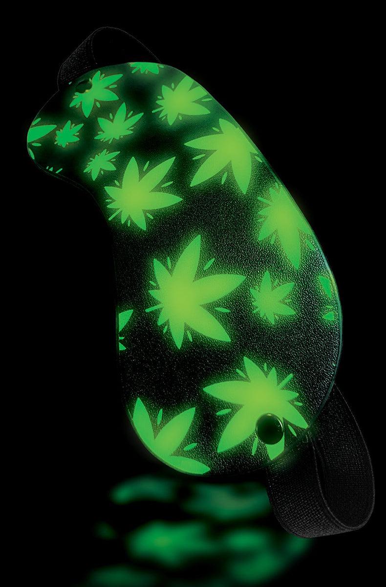 Green cannabis-leaf print blindfold with wide elastic strap and button closure.