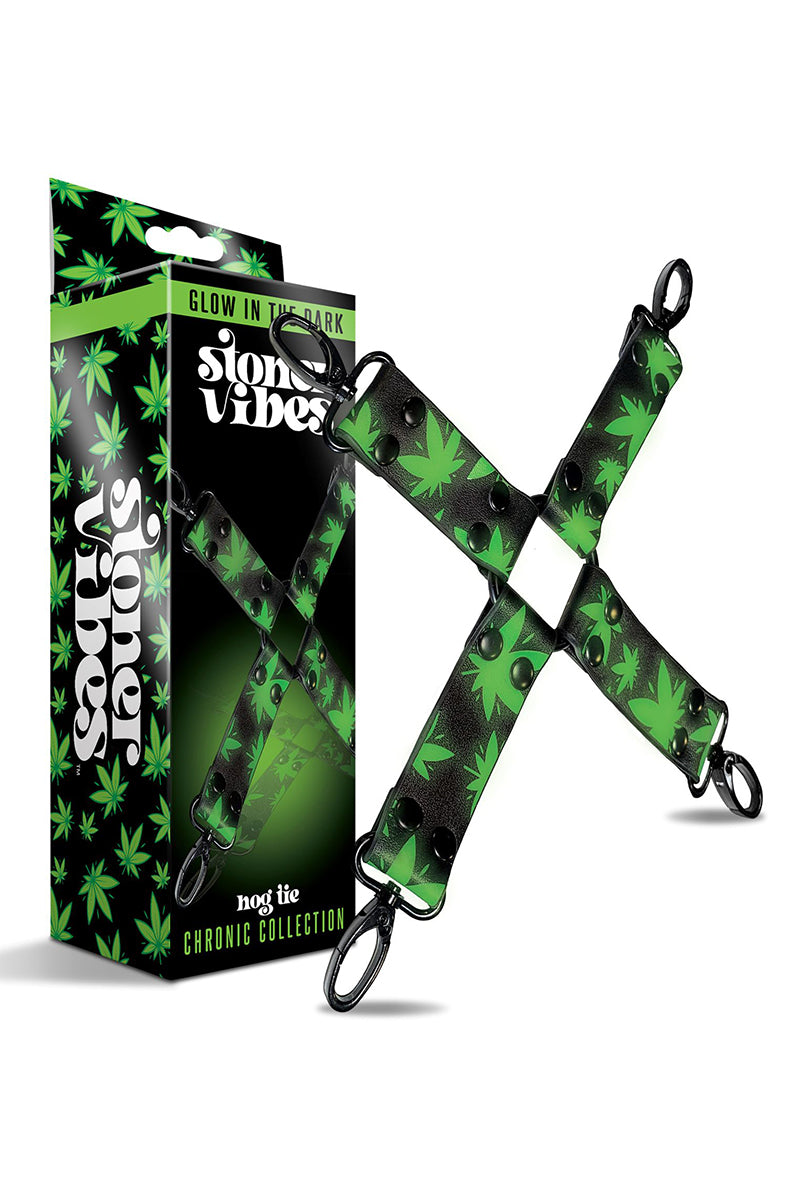 Detail view of glow-in-the-dark hogtie shown under low light with green cannabis-leaf print illuminated.