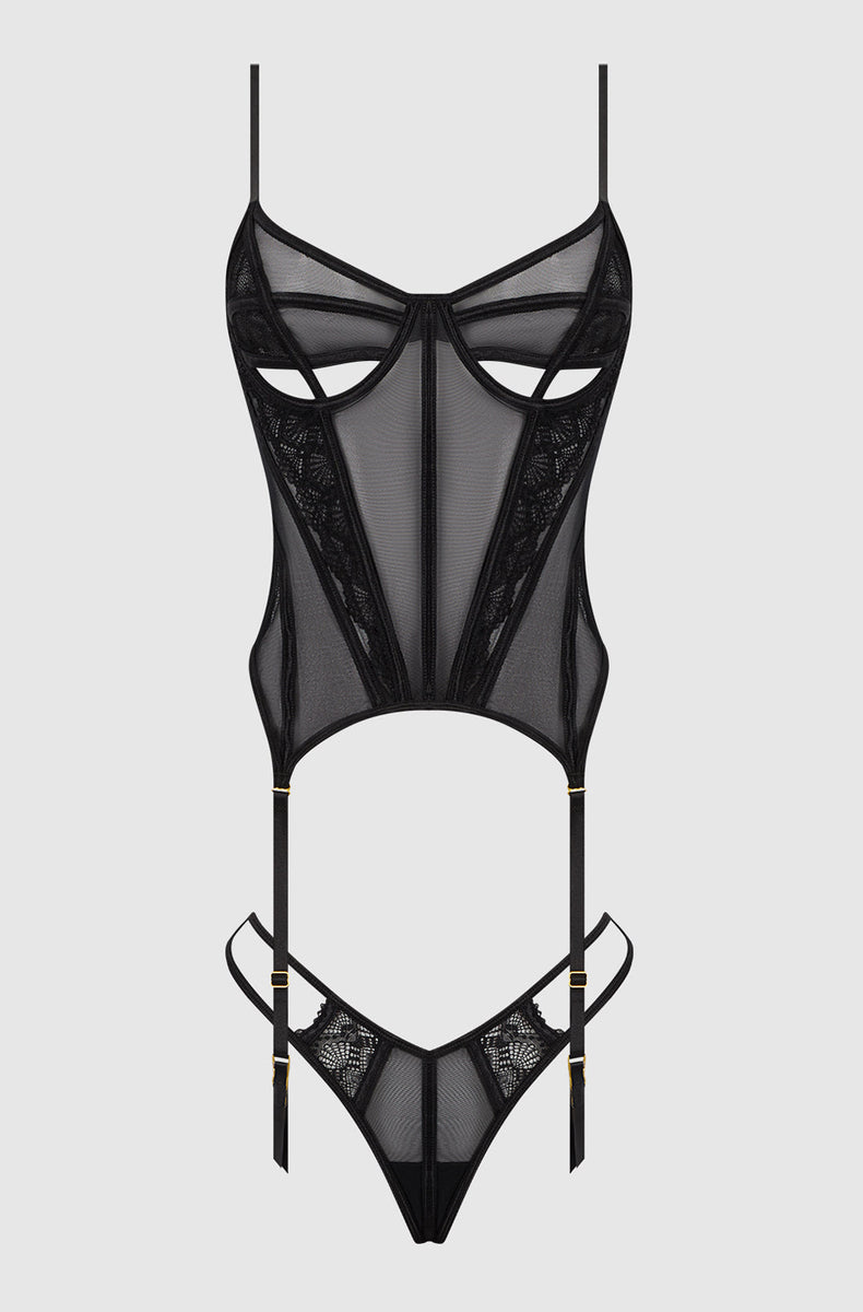 Black peekaboo bustier and g-string laid flat