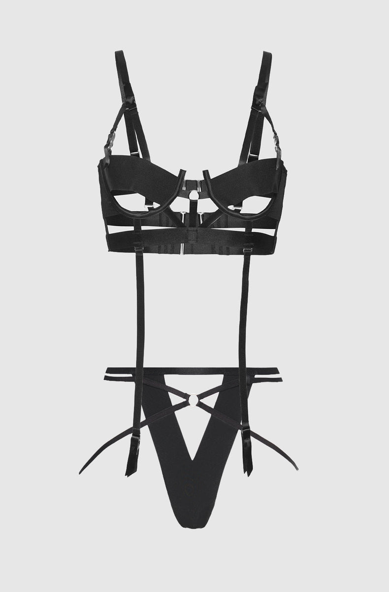 Black caged open cup bra and crotchless g-string with garter straps laid flat