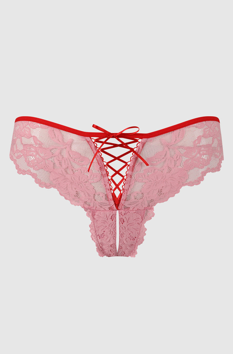 Scarlet Pink lace tanga laid flat, light pink lace with red trim and red lace-up front