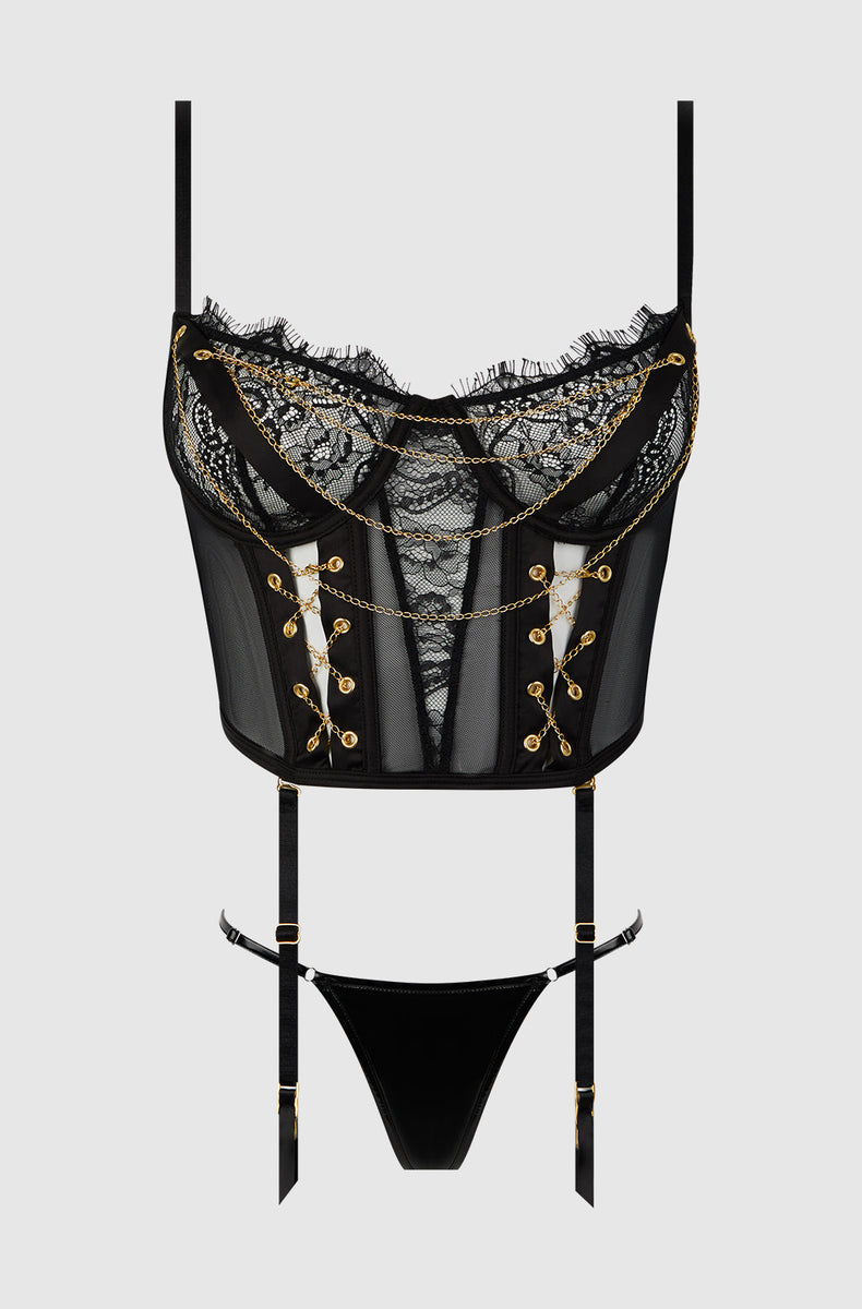 Black and gold lace chain bustier and g-string laid flat