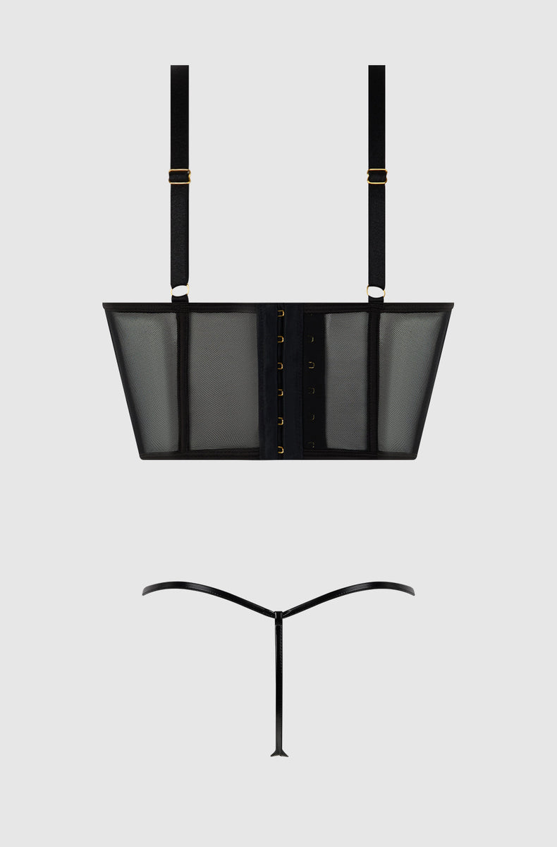 Black mesh bustier and g-string laid flat from the back