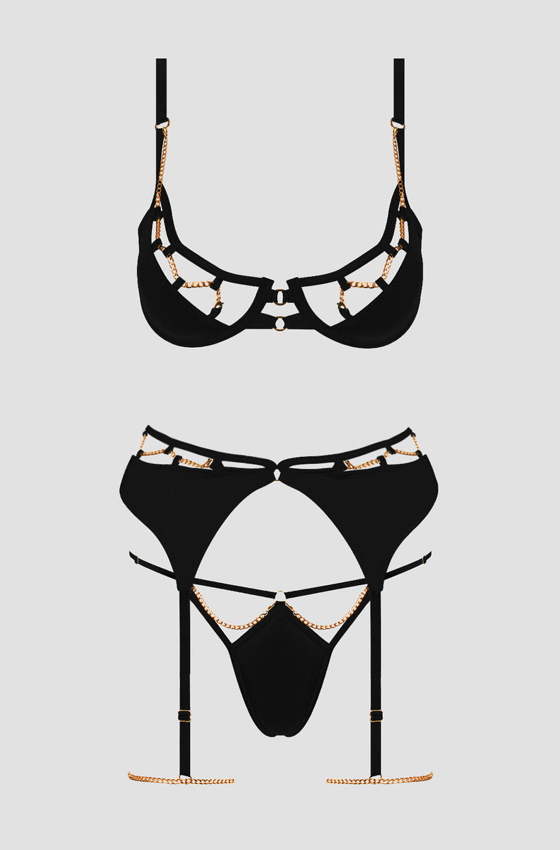 Black satin and gold chain bra, garter belt and thong laid flat