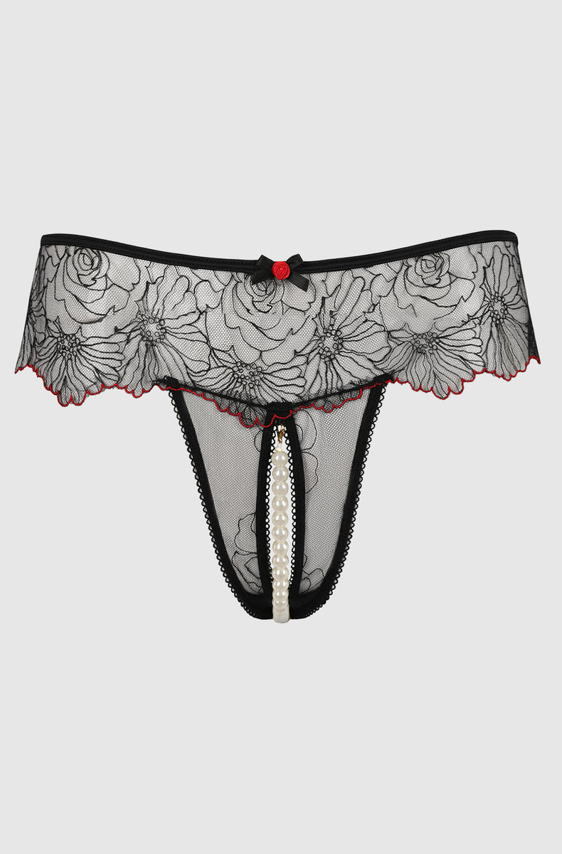 Black embroidered tulle crotchless thong laid flat with red picot trim, red bow and pearl string