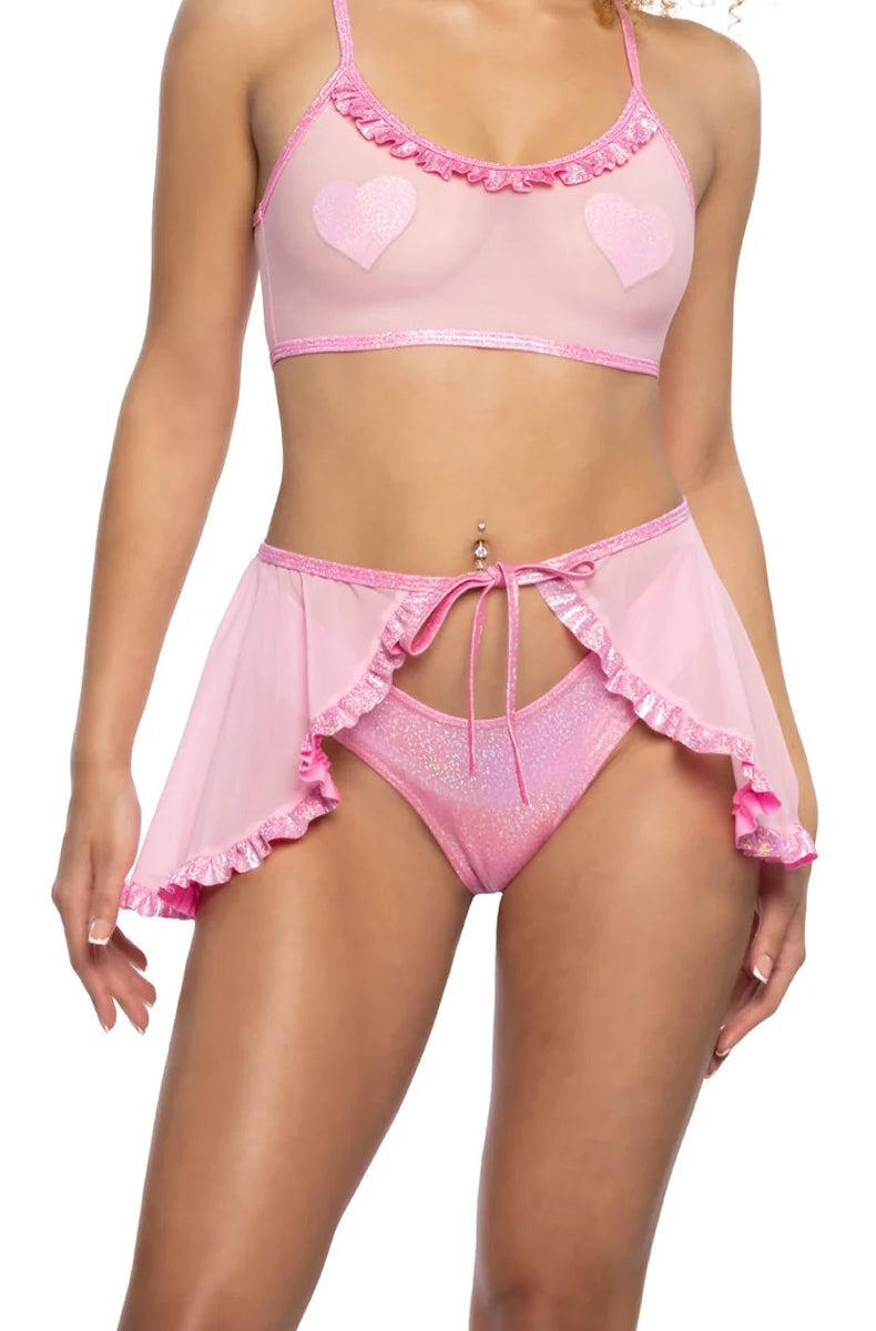 Model wearing sheer baby pink stretch mesh wrap skirt with bubblegum pink ruffle hem and front tie