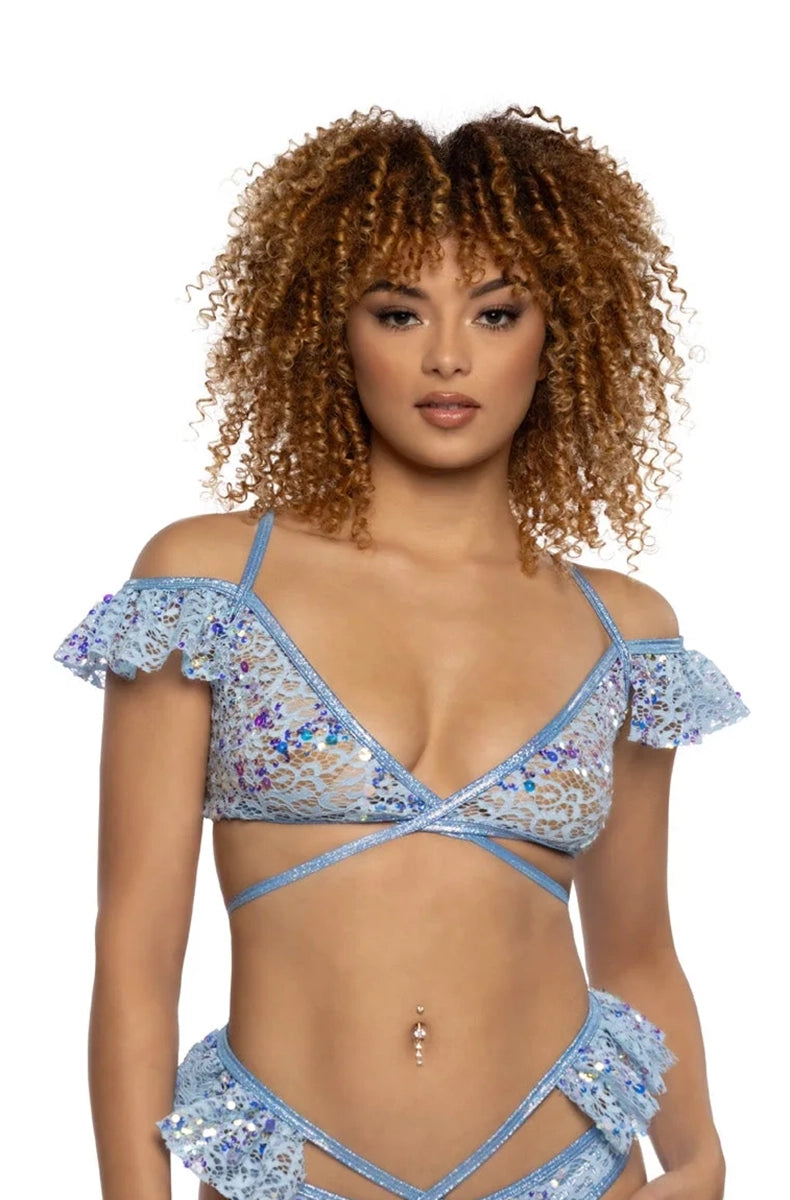 Model wearing light blue sequin lace wrap top with off-shoulder ruffle sleeves