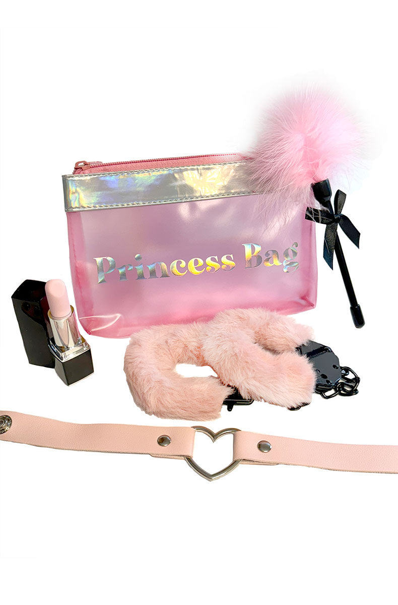 Pink holographic pouch labeled Princess Bag with a lipstick vibe, leather heart collar, feather tickler, and fur cuffs.