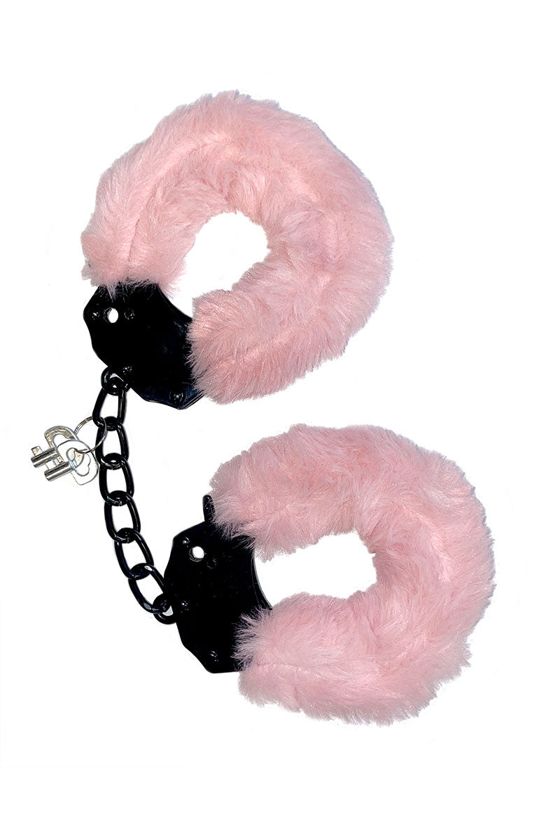 Close-up of pink leather collar with heart-shaped silver pendant and buckle closure.